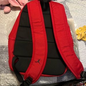 New red Jordan back pack,new never used no damage,tags still attached